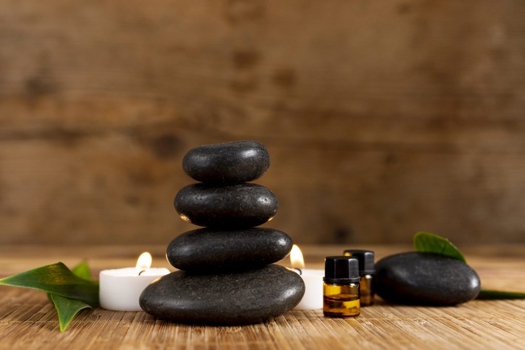 Spa arrangement with hot stones and candlelight at @wellness Beauty
